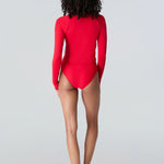 Woman in Watskin Sasha tee and Belle bikini bottom in Red