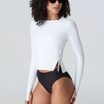 Woman in sunglasses wearing Watskin Sasha tee in White and Belle bikini in Black
