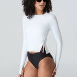 Woman in sunglasses wearing Watskin Sasha tee in White and Belle bikini in Black