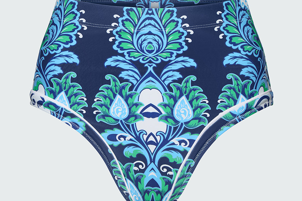 High-waisted bikini bottom with blue and green floral
 pattern on a light gray background