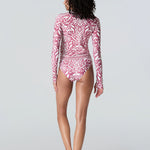 Rear view of woman wearing Watskin rashguard and Belle bikini bottom in Dusty Rose Ikat 