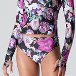 Female model wearing Watskin Sasha tee and Belle bikini bottom in Orchid Bloom 