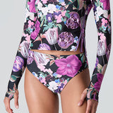Female model wearing Watskin Sasha tee and Belle bikini bottom in Orchid Bloom 