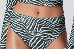 Female model wearing Watskin Clara rashguard and Belle bikini bottom in Blue Zebra