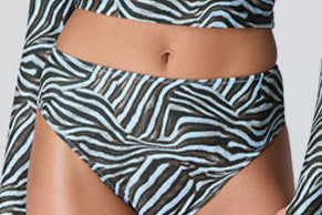 Female model wearing Watskin Clara rashguard and Belle bikini bottom in Blue Zebra