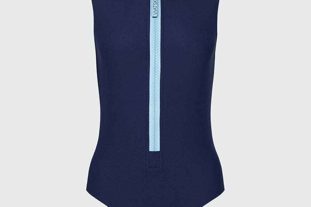 A sleeveless navy blue bodysuit with a light blue front zipper.