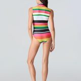 Full body back view of woman wearing a brightly colored striped sleeveless swimsuit on a gray background