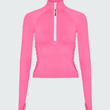 A pink long-sleeve 1/2 zip rashguard with side ruching