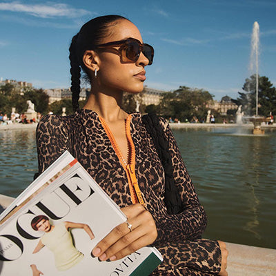 Woman in Paris holding Vogue