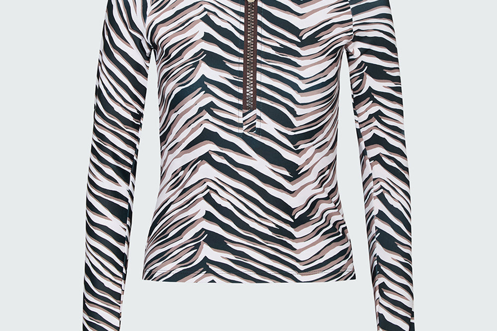 Watskin Kaia half-zip long sleeve rashguard in Natural Zebra print against a light gray background