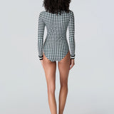 Rear view of woman wearing Watskin Lilia bodysuit in black/ivory houndstooth 