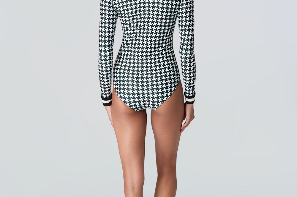 Rear view of woman wearing Watskin Lilia bodysuit in black/ivory houndstooth 