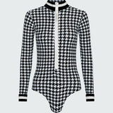 Watskin Lilia bodysuit in black/ivory houndstooth shown flat against a white background