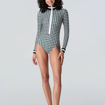 Woman wearing Watskin Lilia bodysuit in black/ivory houndstooth 