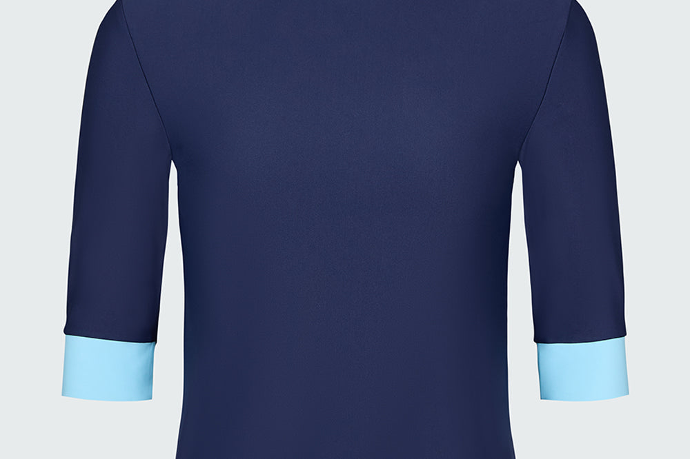 A navy blue short-sleeve top with light blue cuffs and neck trim.