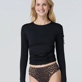 Front view of a woman wearing a black long-sleeve sun protective tee and black bikini bottom