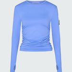 A light blue long-sleeve sun protective tee with side ruching and arm zip 