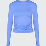 A light blue long-sleeve sun protective tee with side ruching and arm zip 