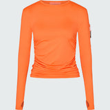 Orange long-sleeve sun protective tee with side ruching and arm zip pocket