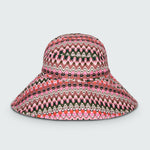 Pink and green wavy striped patterned wide brimmed sun hat on a white background
