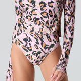 Pink leopard print long sleeve swim top and swim bikini bottom on a gray background