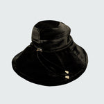 Watskin Sienna black velvet sunhat with cord detailing and gold hardware shown against a light background
