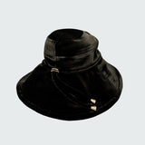 Watskin Sienna black velvet sunhat with cord detailing and gold hardware shown against a light background